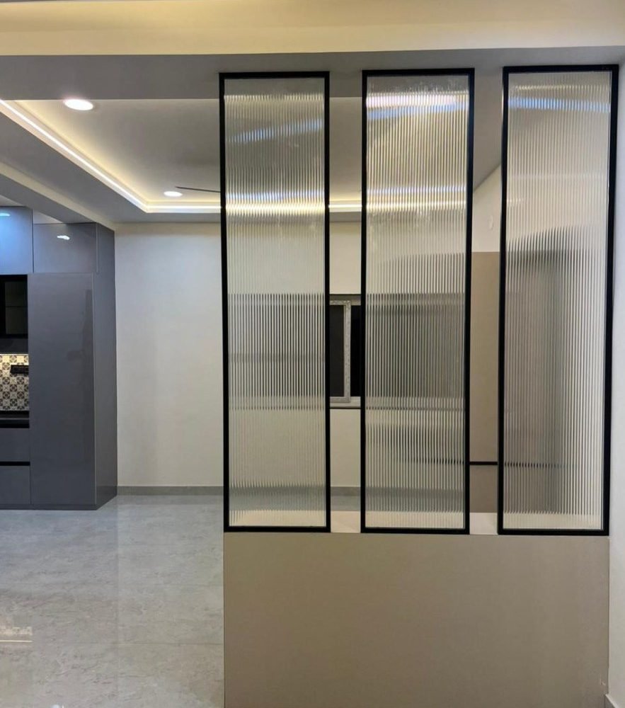 Reeded glass partition in black frames